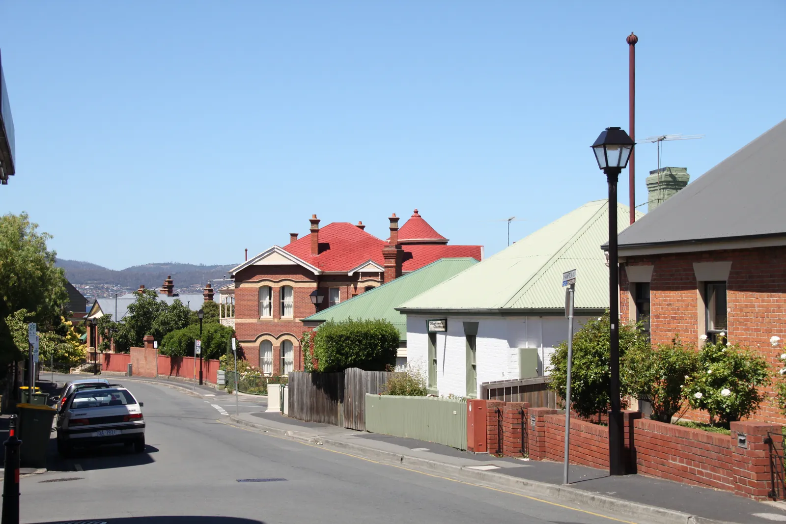 Historic cottages lining a sloping street in Battery Point, Hobart