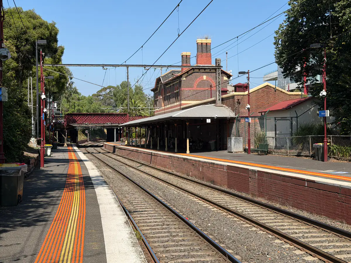 Railway tracks and the historic brick station building at Windsor Station