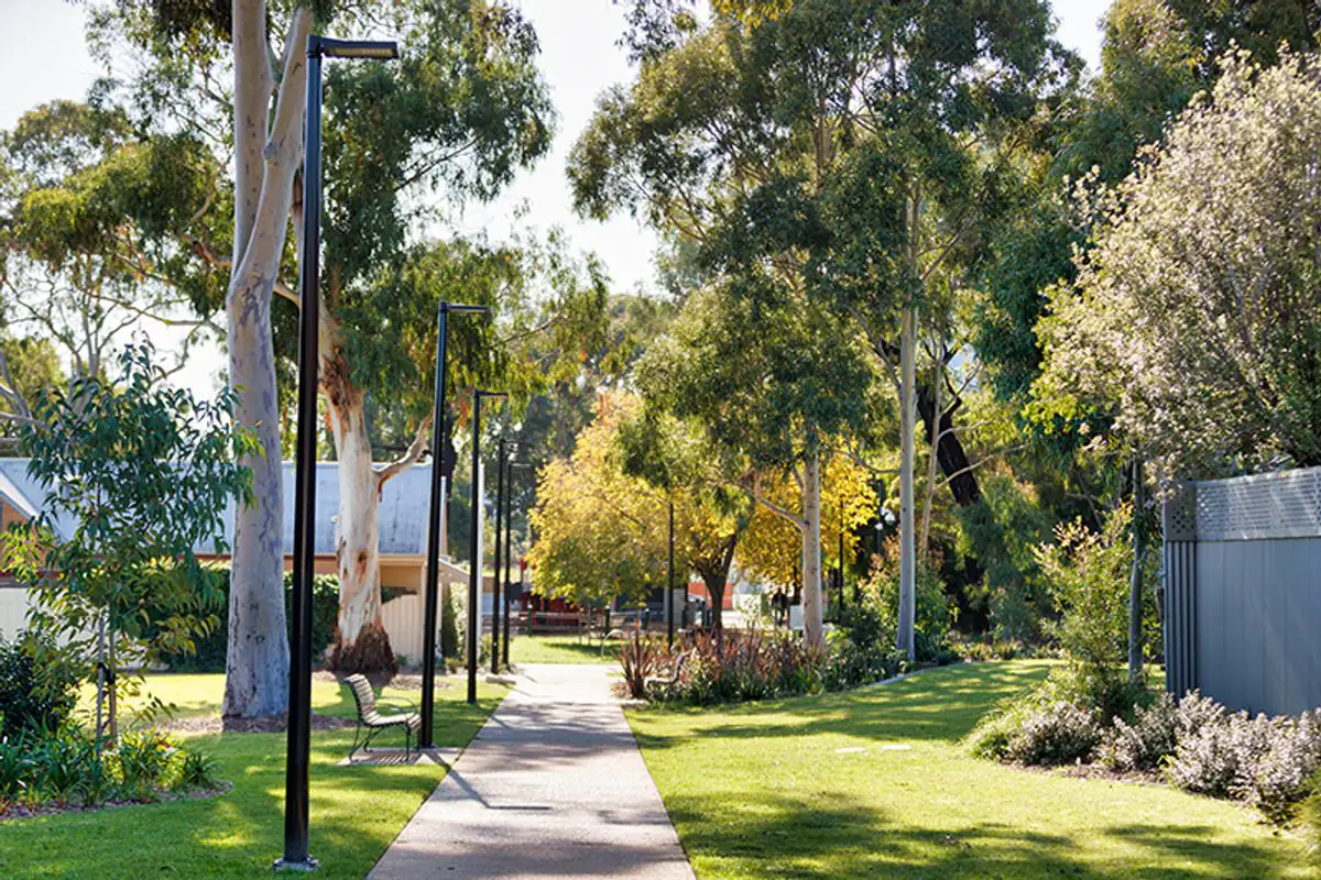 Tree-lined path and lawns through Windsor Siding Reserve